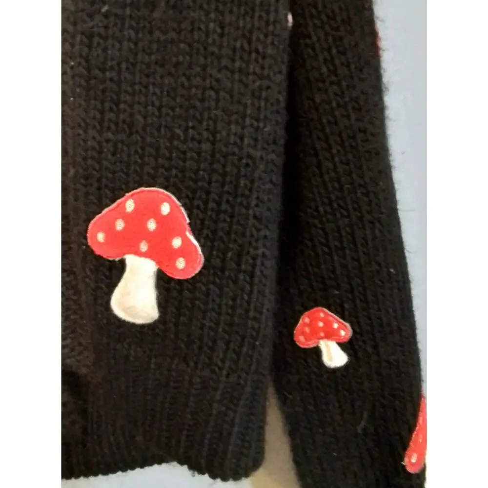 Forever 21 black sweater with red mushrooms.